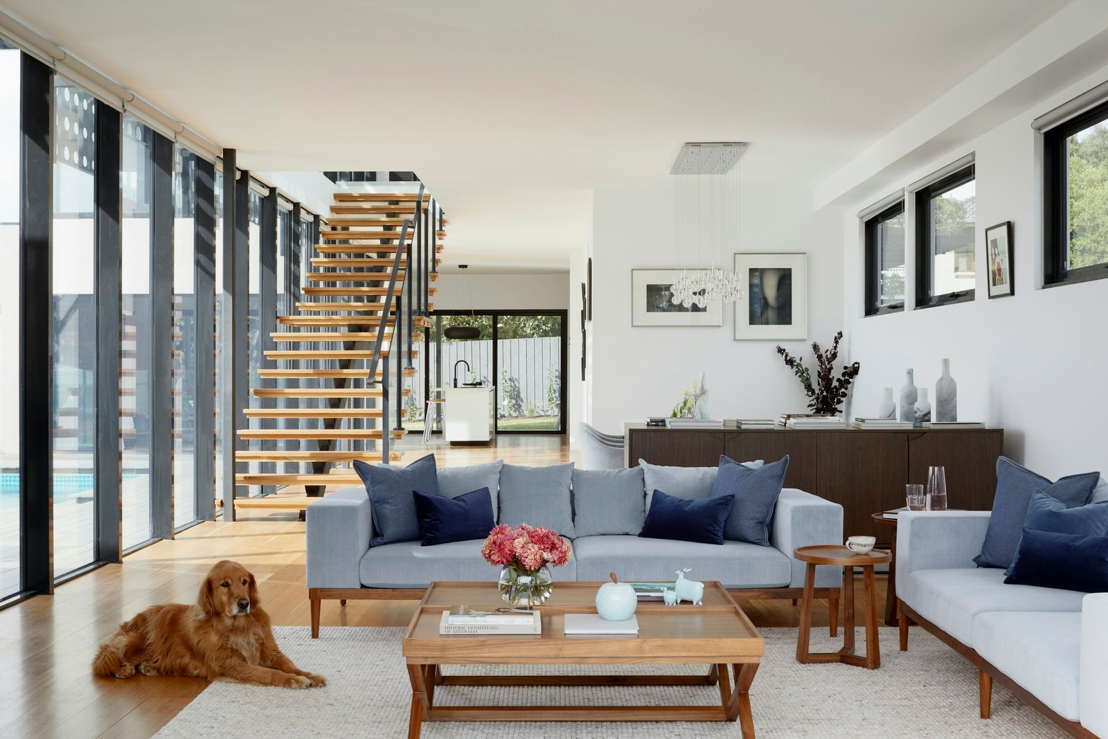 Bright open living space with an open staircase. Stock design inspiration.